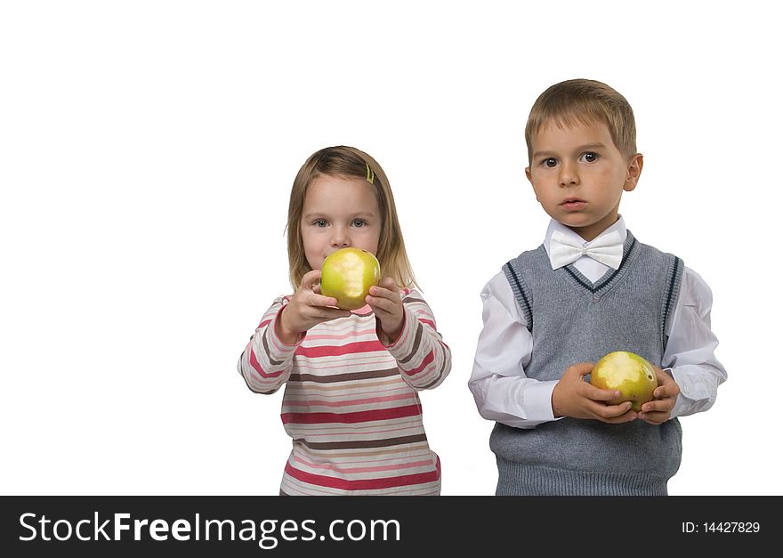 Pretty Boy and beautiful girl is eating big yellow apples. Pretty Boy and beautiful girl is eating big yellow apples