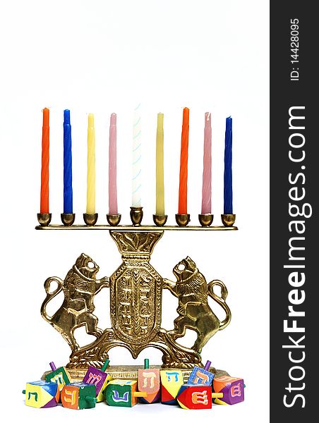 Brass lion menorah with candles and dreidels. Brass lion menorah with candles and dreidels