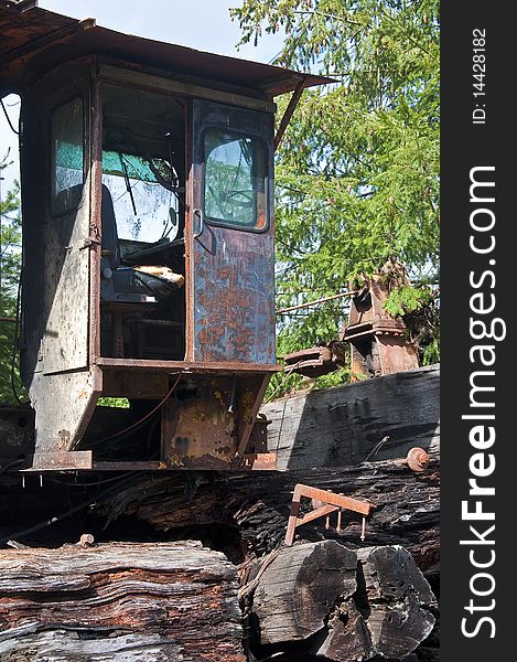 Control cab of rusting bulky logging equipment