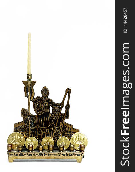 Brass and black menorah with gold covered chocolate coins. Brass and black menorah with gold covered chocolate coins