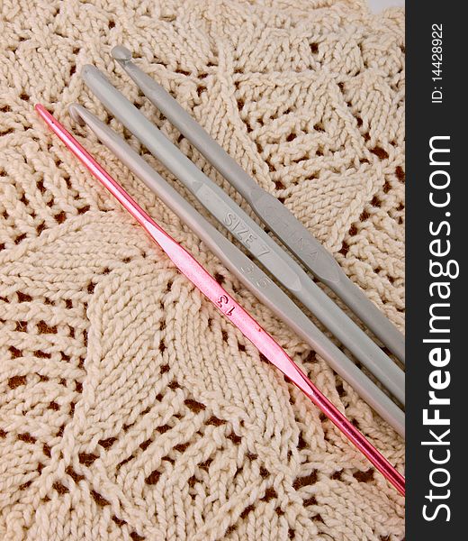Crochet hooks. Close up.Knitting in the background
