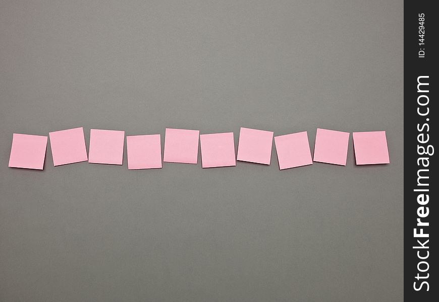 Pink Adhesive Notes in a row