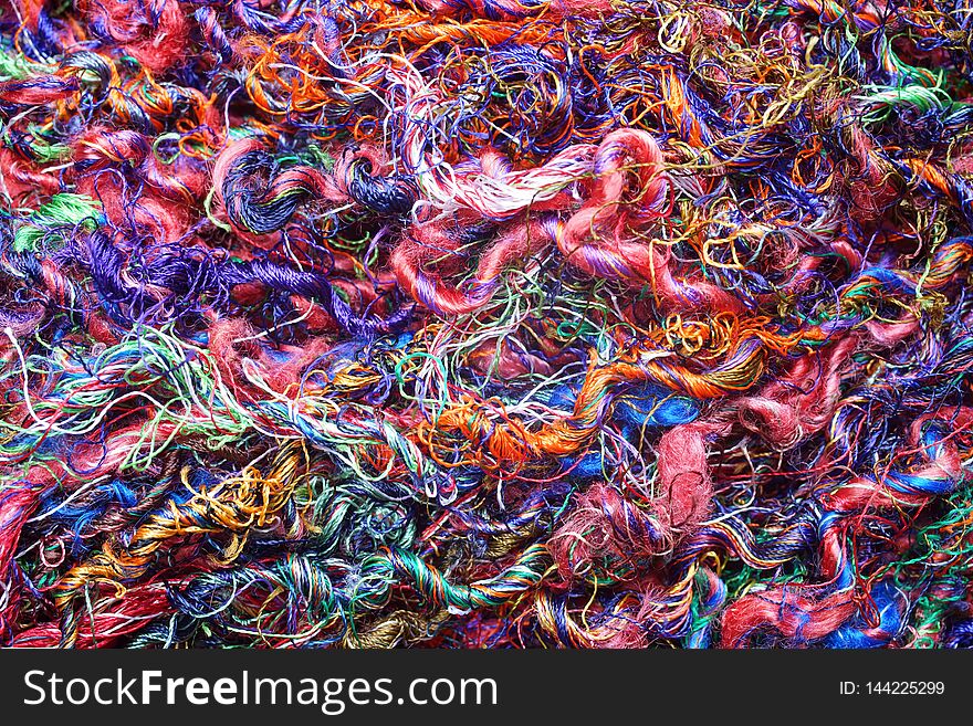 Macro close up of mixed colorful wool fibers