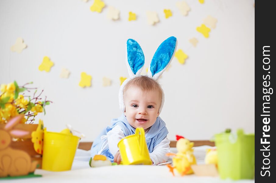 Happy baby boy with Easter bunny ears