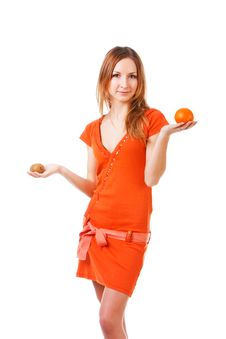 Young Pretty Girl In Dress With Orange And Kiwi Royalty Free Stock Photos Young Pretty Girl In Dress With Orange And Kiwi Royalty Free Stock Photos