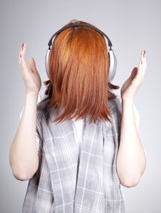 Unusual Red-haired Girl With Headphones Royalty Free Stock Image Unusual Red-haired Girl With Headphones Royalty Free Stock Image