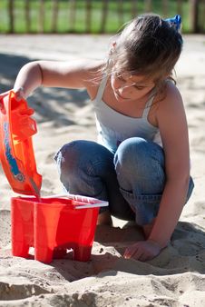 Girl Playing In A Sand Pit Royalty Free Stock Photography Girl Playing In A Sand Pit Royalty Free Stock Photography