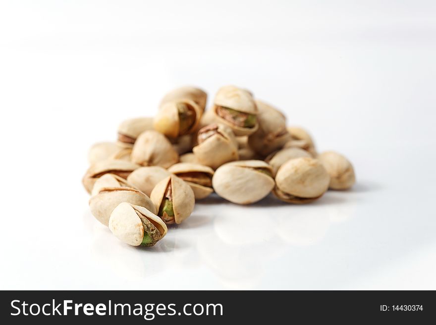 Row of pistachios on a white background. Row of pistachios on a white background
