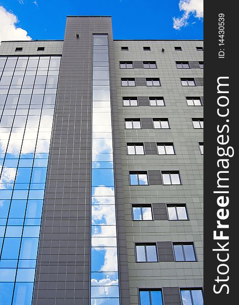 Facade of modern office building on a background of the blue sky