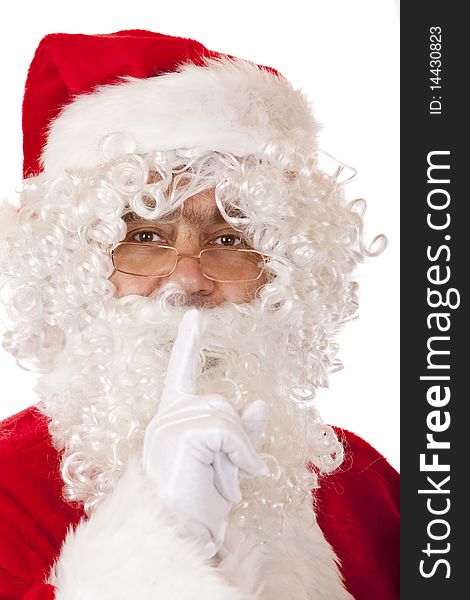 Closeup of Santa Claus holding his finger on lips to have silence. Isolated on white. Closeup of Santa Claus holding his finger on lips to have silence. Isolated on white.