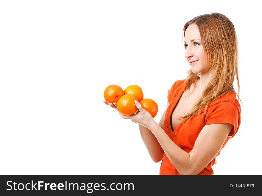Portrait of a young pretty girl in dress which holds oranges. Isolated on white. Portrait of a young pretty girl in dress which holds oranges. Isolated on white.