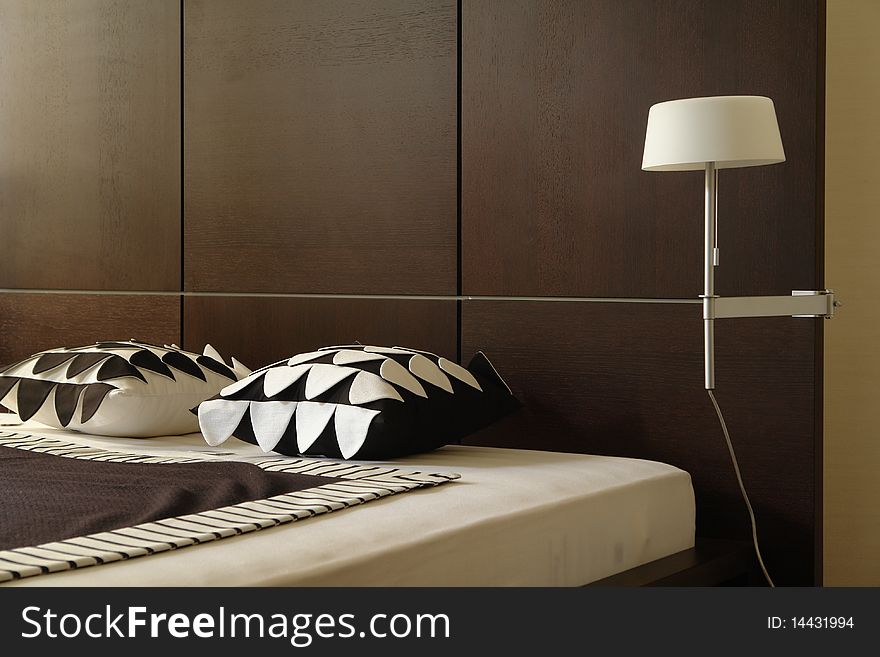 A part of bedroom in brown colors