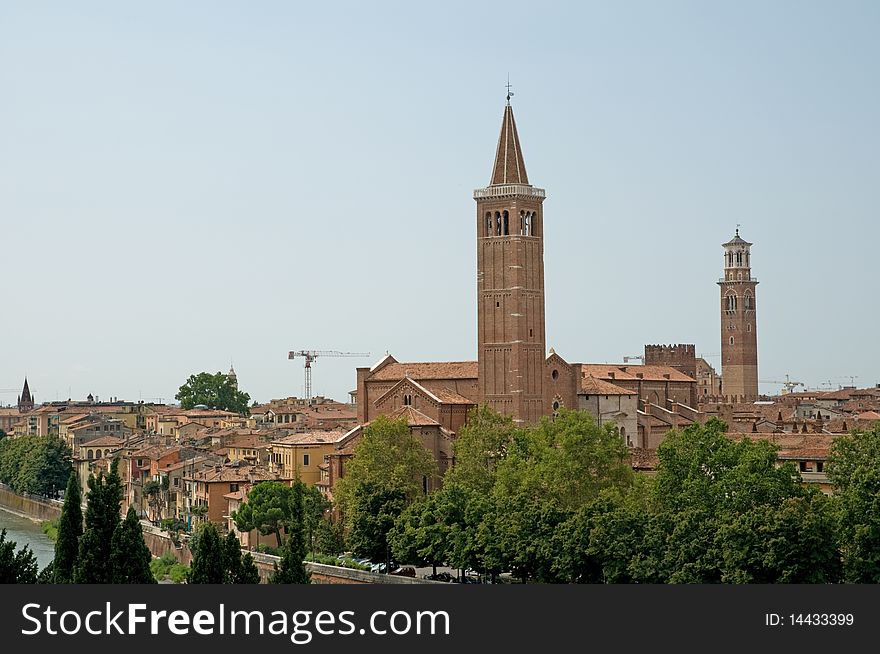 The basilica of sant  anastasia 
 and buildings in verona in italy. The basilica of sant  anastasia 
 and buildings in verona in italy