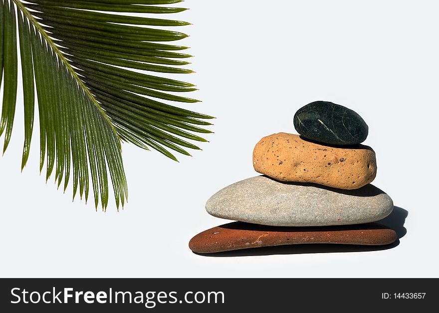 Stones stacked on white background with shadows