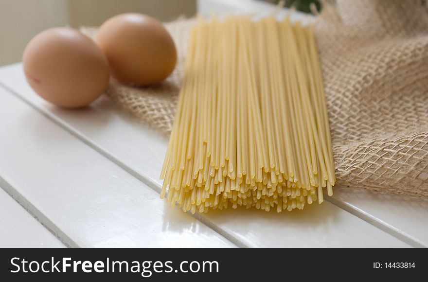 Pasta and egg on the natural sackcloth. Pasta and egg on the natural sackcloth