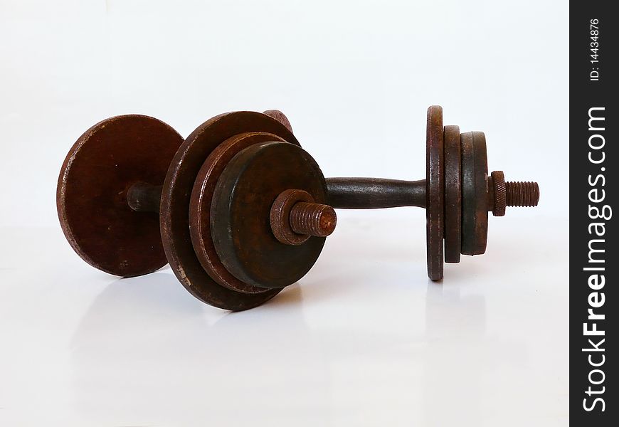 Rusty dumbbells on a white background