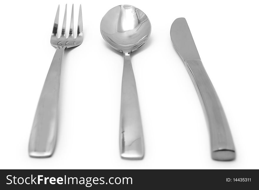 The Silver plug and spoon isolated on grey background. The Silver plug and spoon isolated on grey background