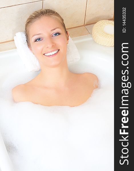 Cacuasian blond woman in bath