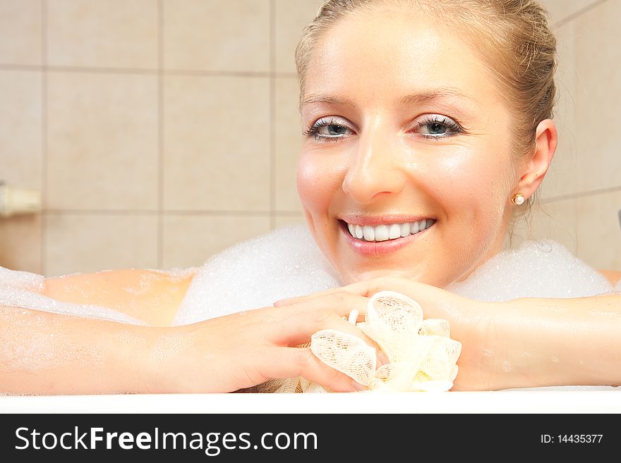 Cacuasian blond woman in bath