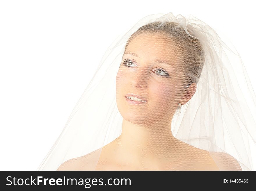 Young woman in wedding dress in studio