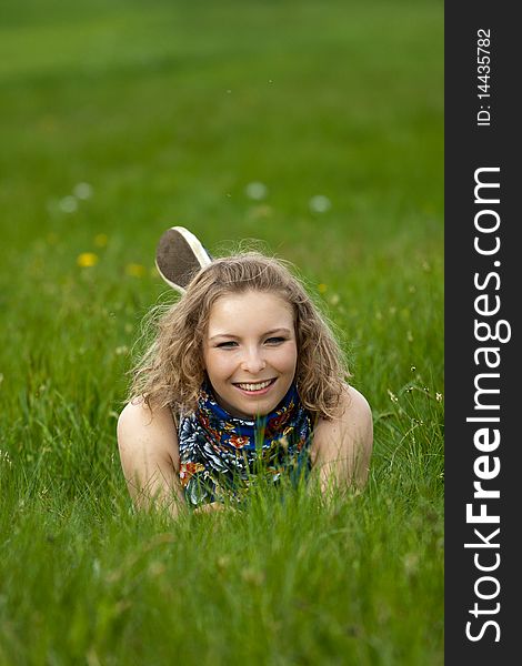 Young Girl Lay In The Grass