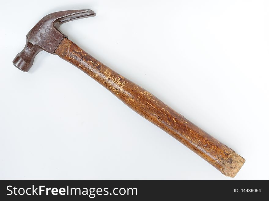 A worn hammer on a white background. A worn hammer on a white background.
