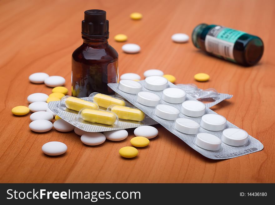 Heap of pills and medicine on a table