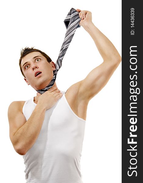 Muscular man hangs himself in a tie isolated white background