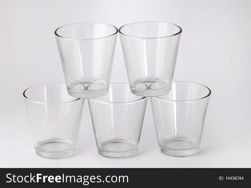 Five glasses with cherries inside
