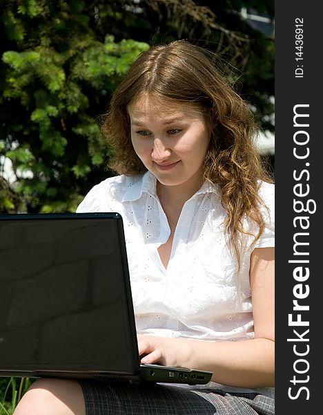 Adorable astonished woman with laptop outdoor. Adorable astonished woman with laptop outdoor