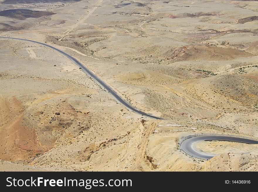 View on dry desert with yellow sand and rocks in Israel