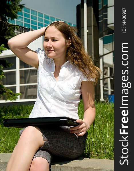 Adirable woman with laptop outdoor. Adirable woman with laptop outdoor