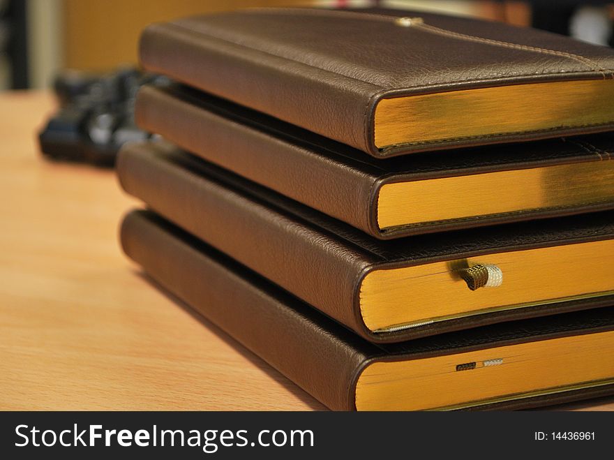 Stack of diaries on table