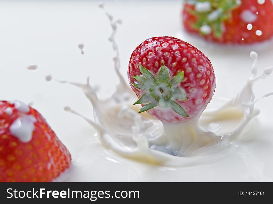 Strawberries Splashing In Milk