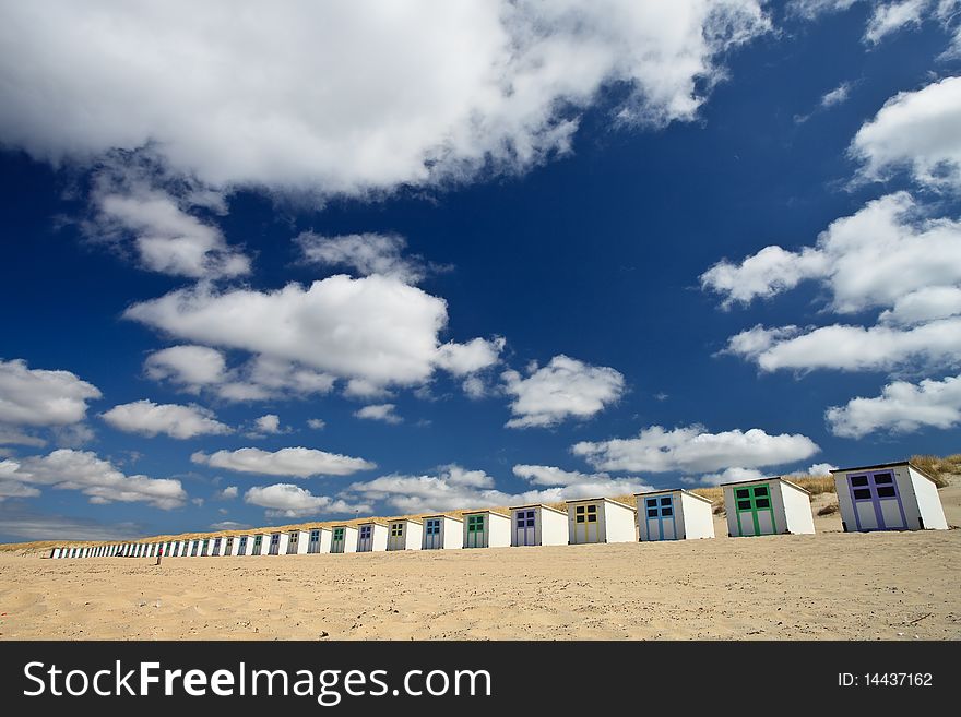 Small rental cabin on the beach with clouds in the blue sky