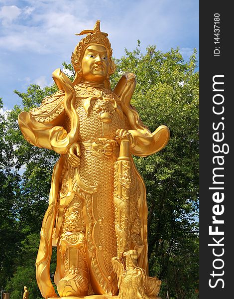 Chinese warrior golden statue in Thai temple