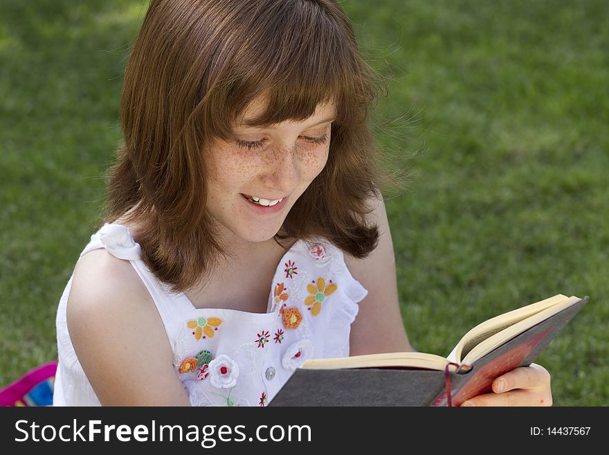 Young Beautiful Girl Reading