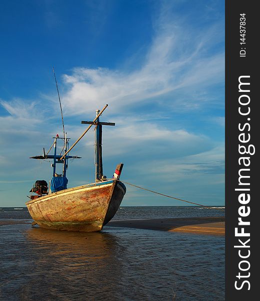 Thai fishing boat at rest with blue sky. Thai fishing boat at rest with blue sky