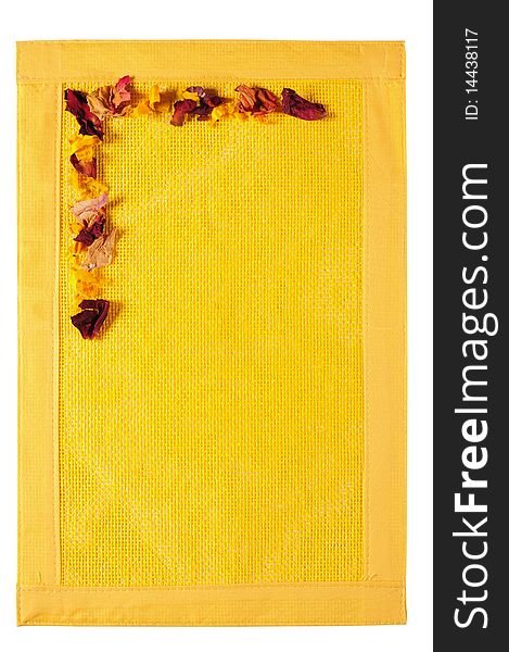 Dried rose petals on vibrant yellow texture. Dried rose petals on vibrant yellow texture.