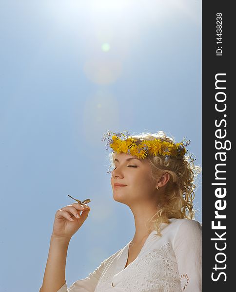 Woman With A Butterfly Over Blue Sky