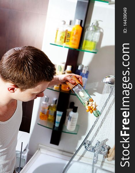 Man making a bath with aroma oil