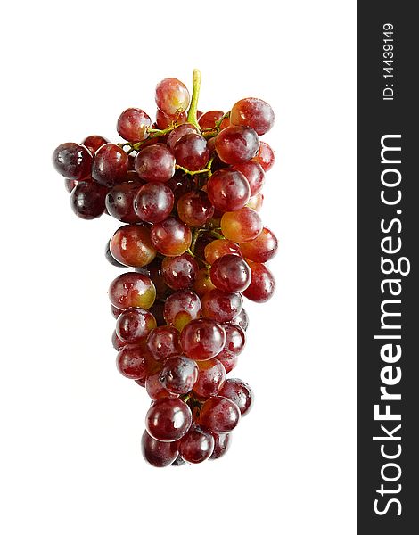 Juicy and fresh bunch of purple grapes on white background