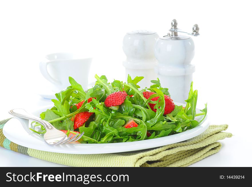 Fresh salad of arugula and strawberries with vinaigrette. Fresh salad of arugula and strawberries with vinaigrette.