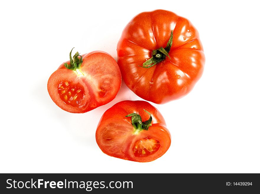Fresh tomato close-up on white background with cut