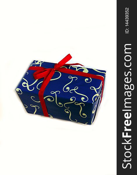 Blue gift box with red ribbon isolated on white background .