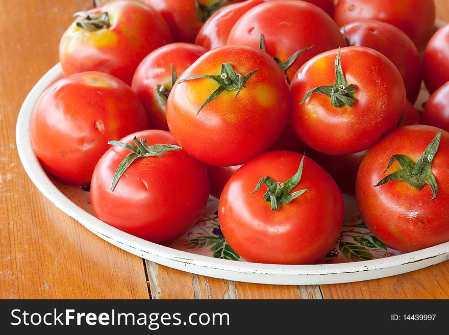 Fresh organic tomatoes in tray