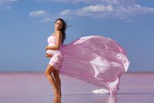 Free Beautiful Young Pregnant Woman Enjoying The Sun On The Beach, Pink Lake Stock Images - 144390934