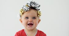 Free Baby Decorated With A Bow As A Gift Royalty Free Stock Image - 144391106