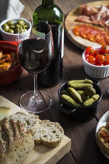Wine And Tapas Dishes On A Wooden Table Royalty Free Stock Images