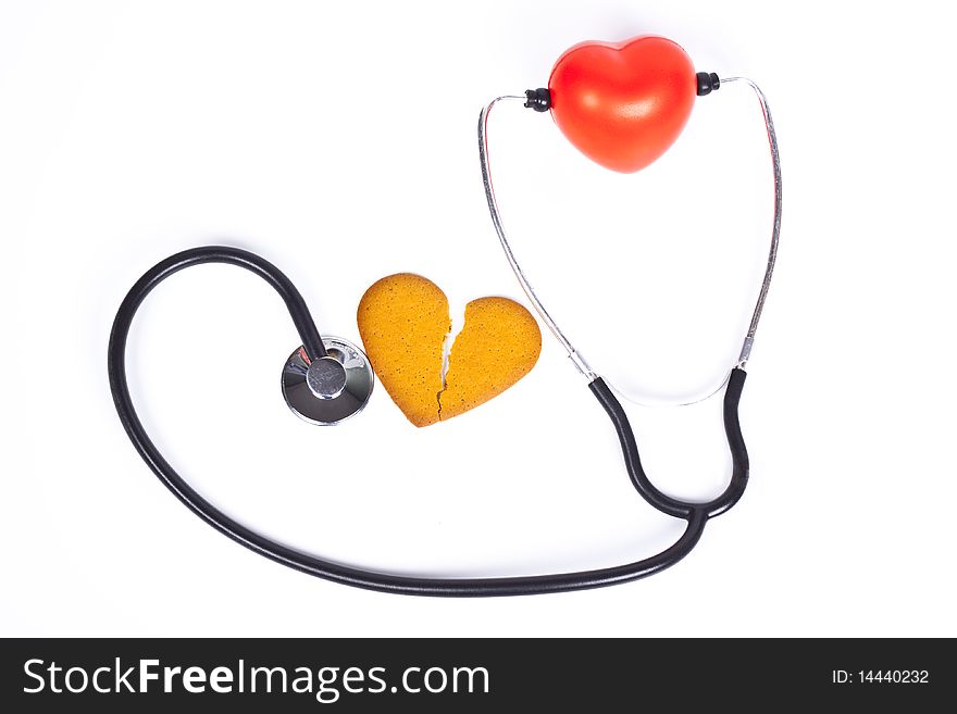 Healing a broken heart with  a sthethoscope on white background